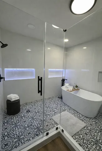 a bathroom with a bathtub and a sink