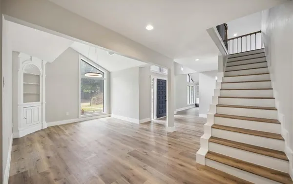 a view of entryway with wooden floor