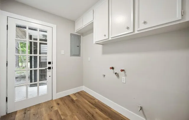 a bathroom with a sink vanity granite tub and a mirror