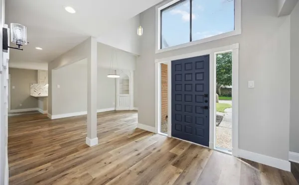 a view of entryway with wooden floor