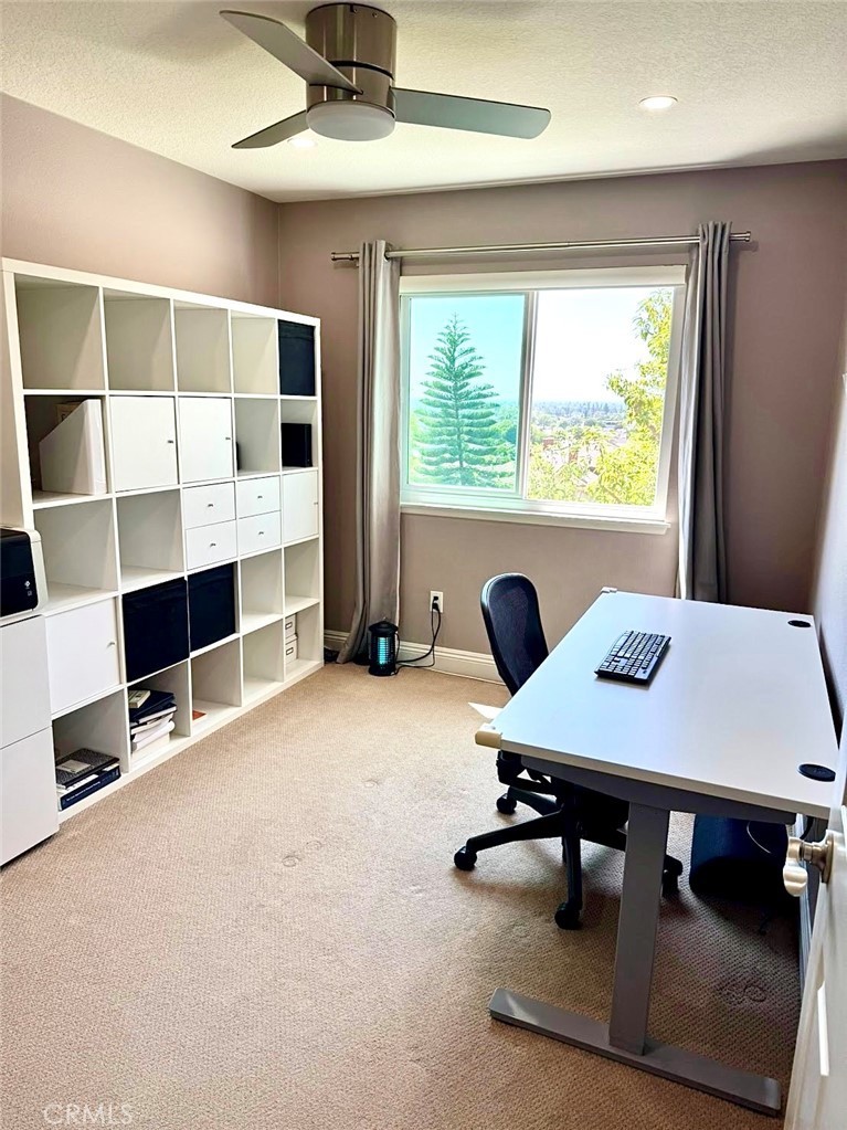16073 Crestline Drive La Mirada, CA 90638 - Photo 18 of 75 a view of a workspace with furniture and a window