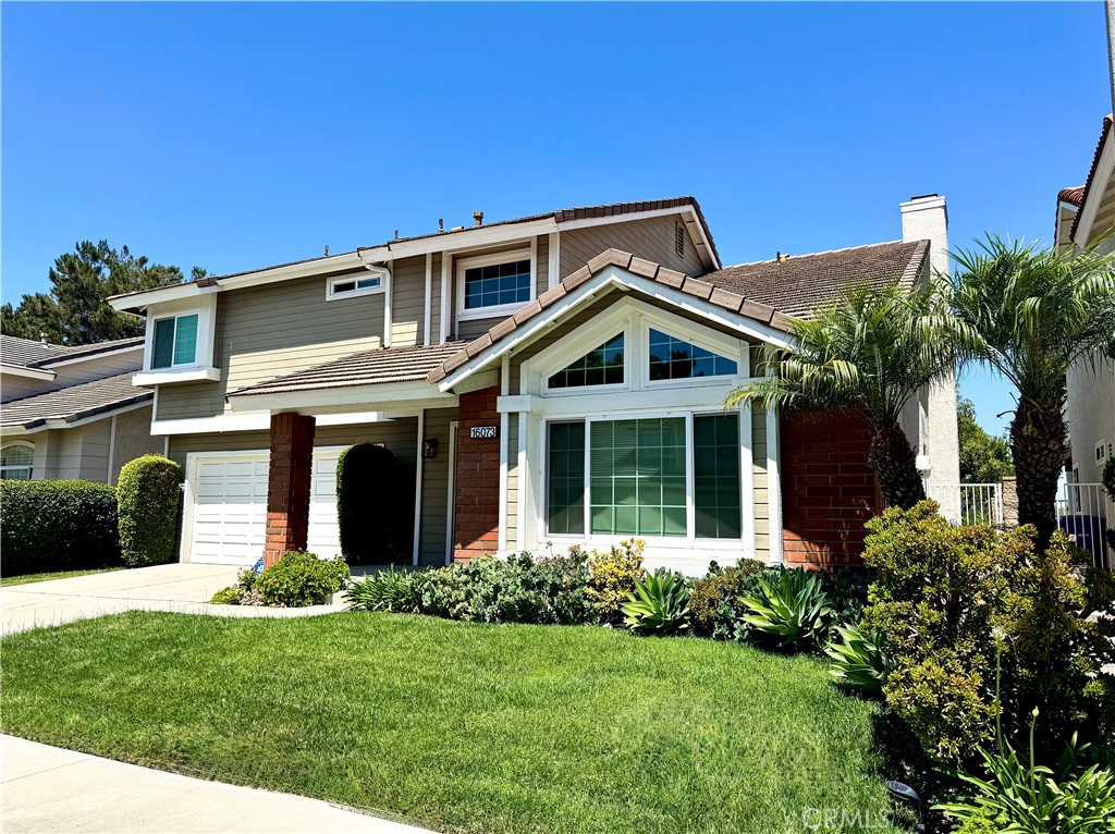 16073 Crestline Drive La Mirada, CA 90638 - Photo 2 of 75 a front view of a house with a yard