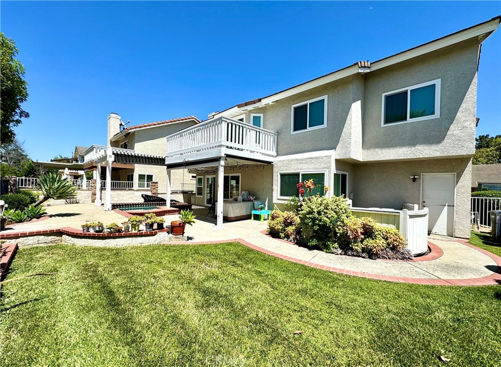 16073 Crestline Drive La Mirada, CA 90638 - Photo 39 of 75 a front view of a house with a yard table and chairs