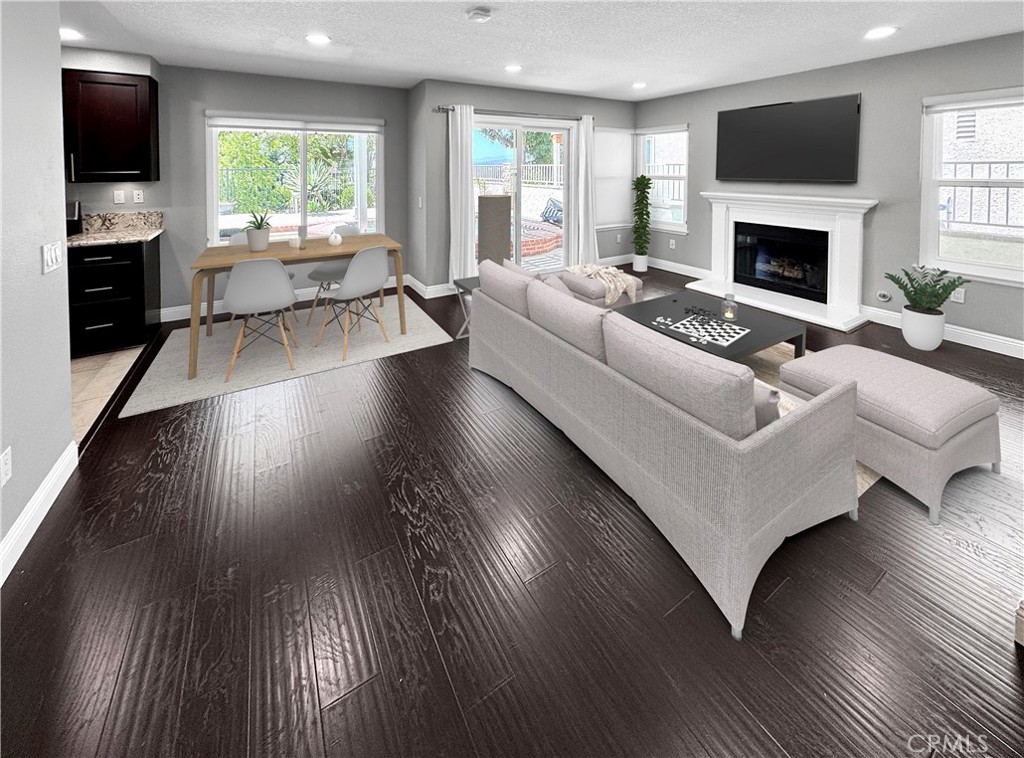 16073 Crestline Drive La Mirada, CA 90638 - Photo 6 of 75 a living room with furniture fireplace and flat screen tv