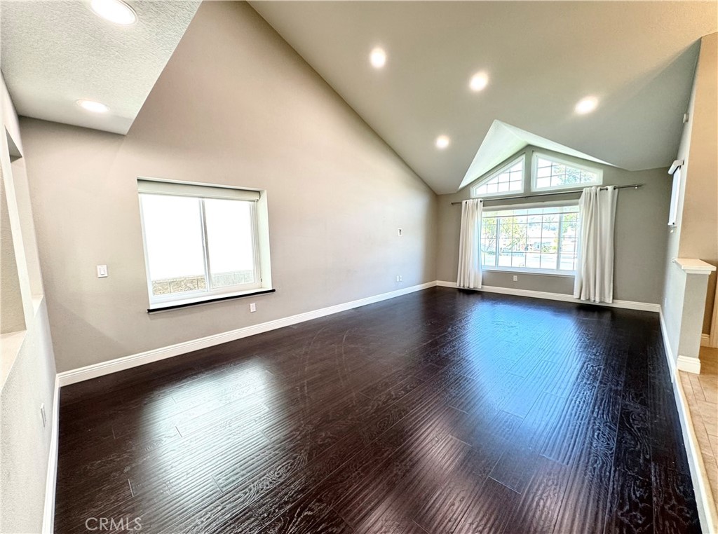 16073 Crestline Drive La Mirada, CA 90638 - Photo 10 of 75 an empty room with wooden floor and windows