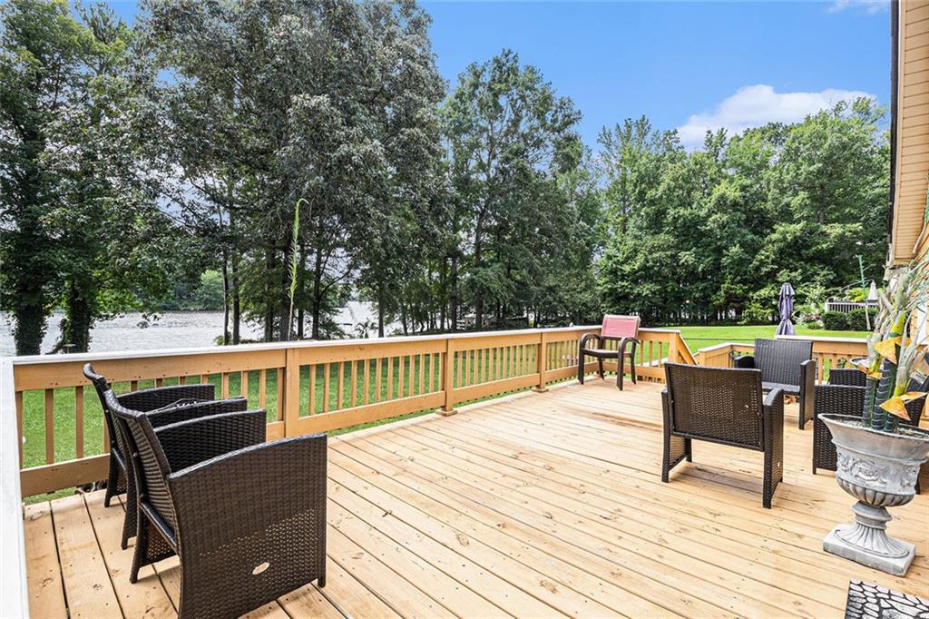 96 Pointe View Court Jackson, GA 30233 - Photo 25 of 36 a roof deck with chairs and wooden floor