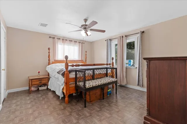 a bed room with furniture and a window