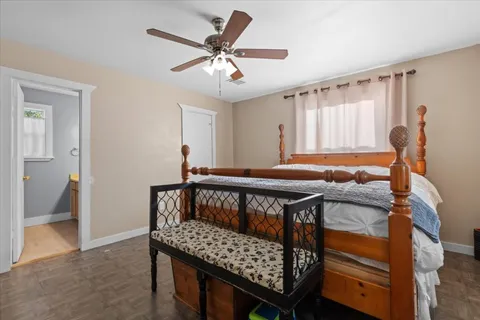 a bedroom with furniture and a window