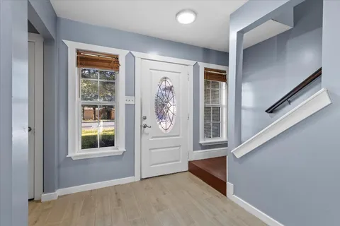 wooden floor and window in an empty room