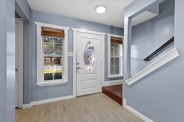 wooden floor and window in an empty room