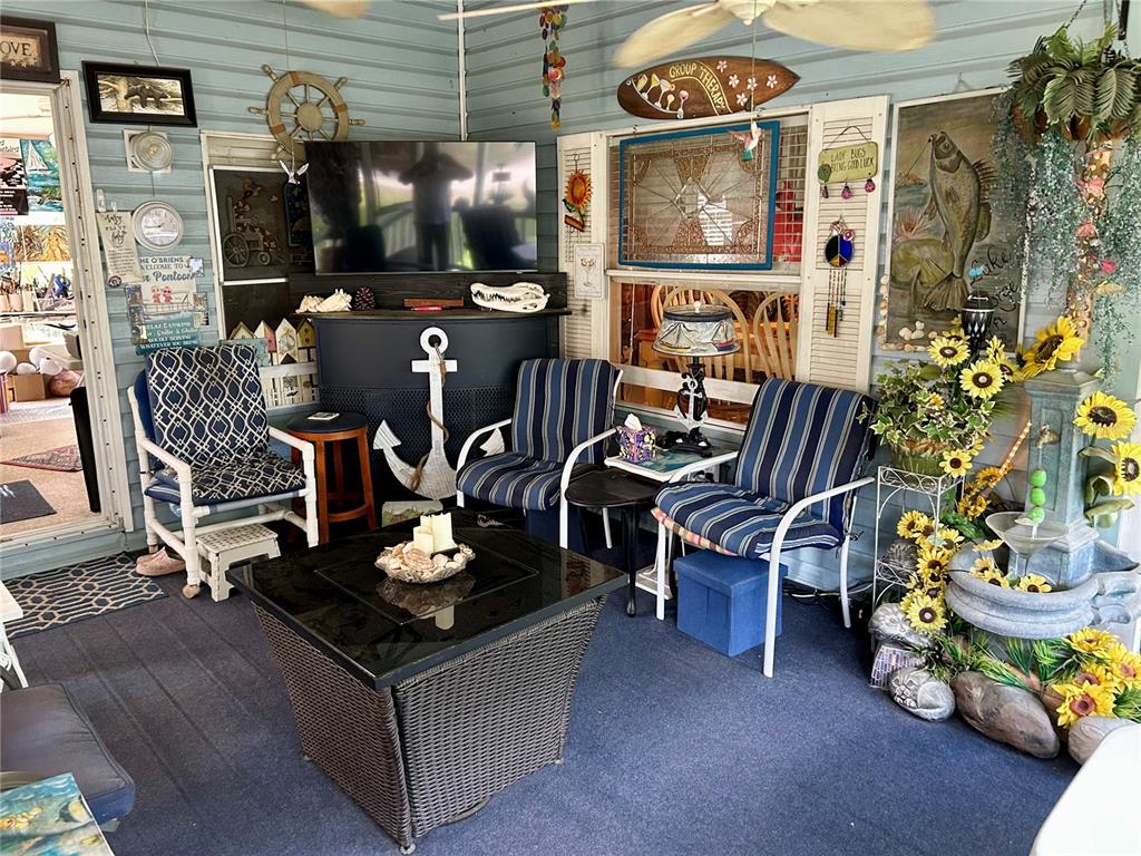 25646 Bass Road Astor, FL 32102 - Photo 29 of 48 a living room with furniture and a window