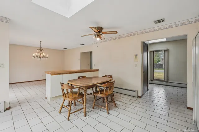 a kitchen with a table and chairs in it