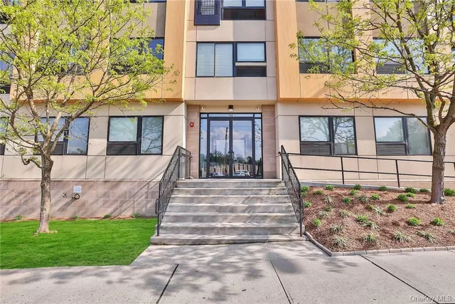 a view of a brick building next to a road