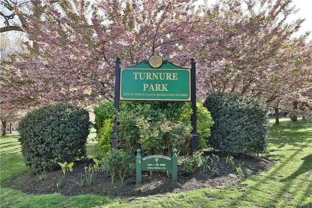 a view of swimming pool with sitting area