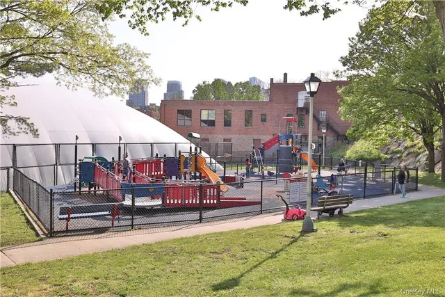 a view of a park with a slide