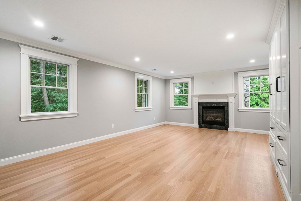 8 Hampshire Road Wellesley, MA 02481 - Photo 19 of 39 an empty room with windows and fireplace