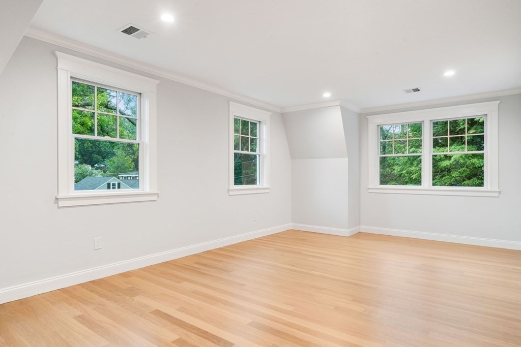 8 Hampshire Road Wellesley, MA 02481 - Photo 27 of 39 a view of an empty room with a window