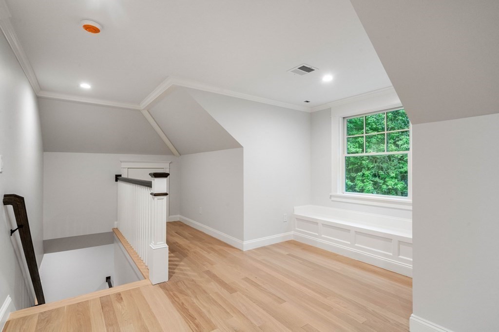 8 Hampshire Road Wellesley, MA 02481 - Photo 29 of 39 a view of empty room with wooden floor and fan
