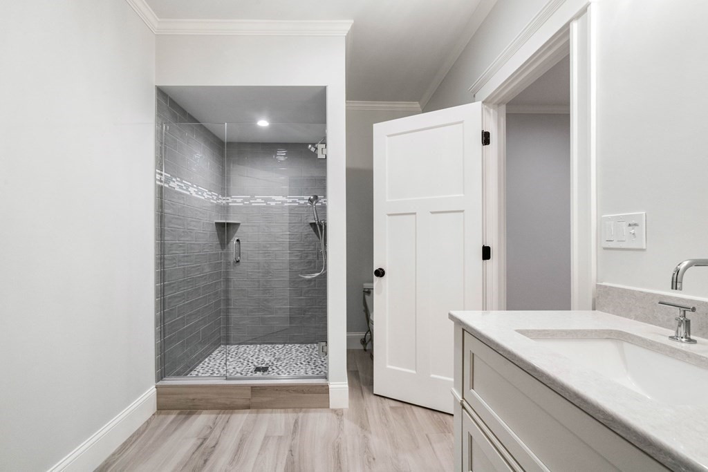 8 Hampshire Road Wellesley, MA 02481 - Photo 38 of 39 a bathroom with a sink a toilet and shower