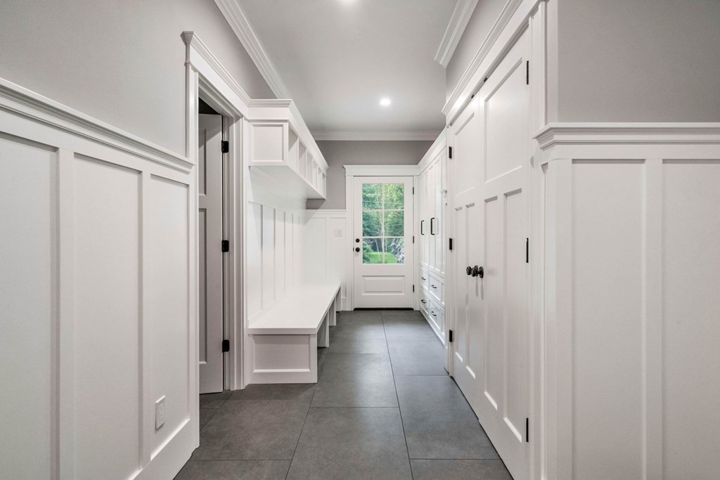 8 Hampshire Road Wellesley, MA 02481 - Photo 39 of 39 a view of a hallway with a white walls