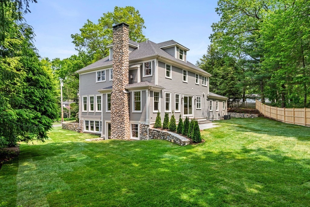 8 Hampshire Road Wellesley, MA 02481 - Photo 7 of 39 a front view of a house with garden and trees