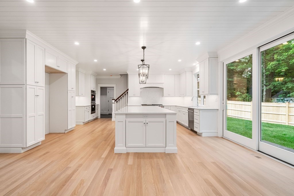 8 Hampshire Road Wellesley, MA 02481 - Photo 9 of 39 a large kitchen with kitchen island a sink stainless steel appliances and cabinets