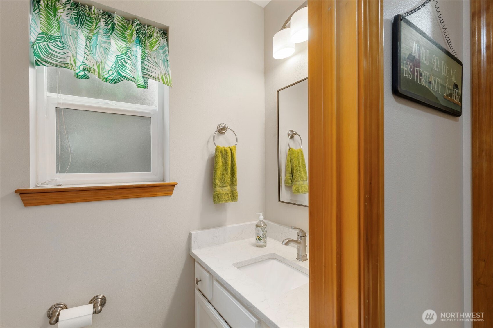 9240 Priddy Vista Road Northwest Seabeck, WA 98380 - Photo 13 of 40 a bathroom with a sink and a mirror