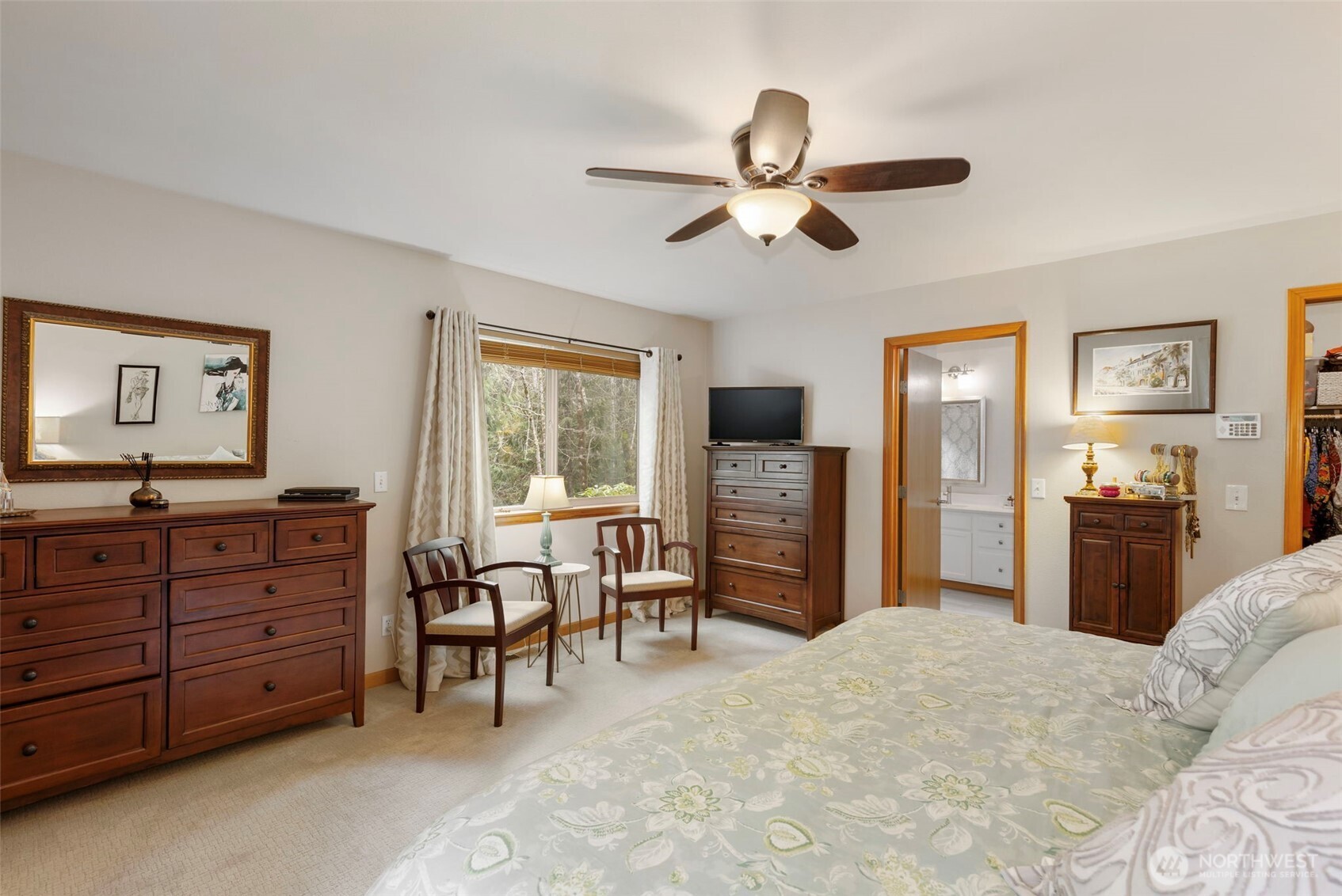 9240 Priddy Vista Road Northwest Seabeck, WA 98380 - Photo 16 of 40 a bed room with a bed and a television