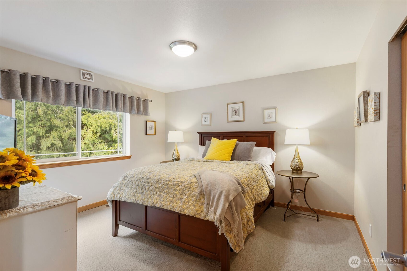 9240 Priddy Vista Road Northwest Seabeck, WA 98380 - Photo 20 of 40 a bedroom with a bed and a window
