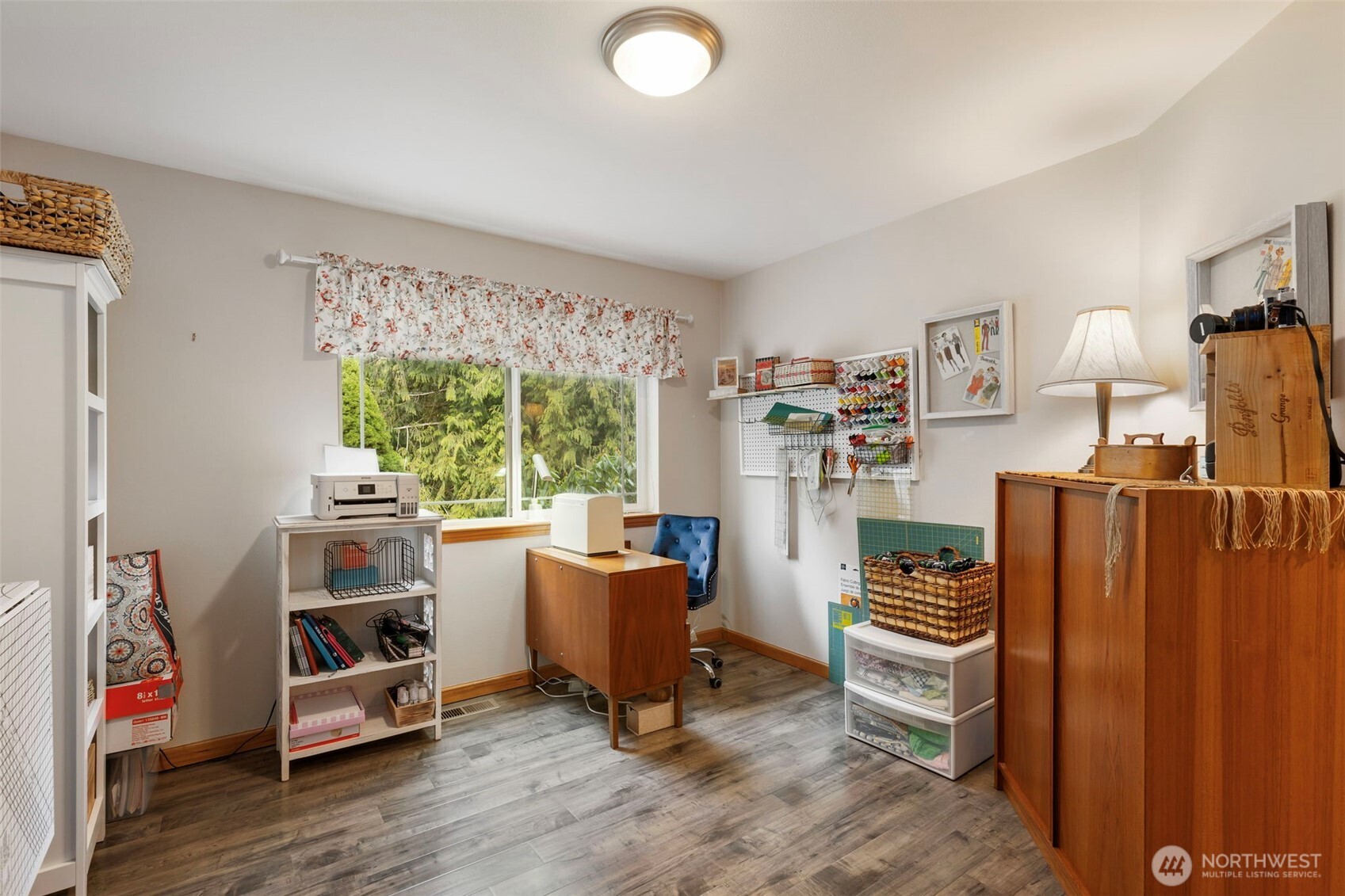 9240 Priddy Vista Road Northwest Seabeck, WA 98380 - Photo 22 of 40 a view of a workspace with furniture and a window
