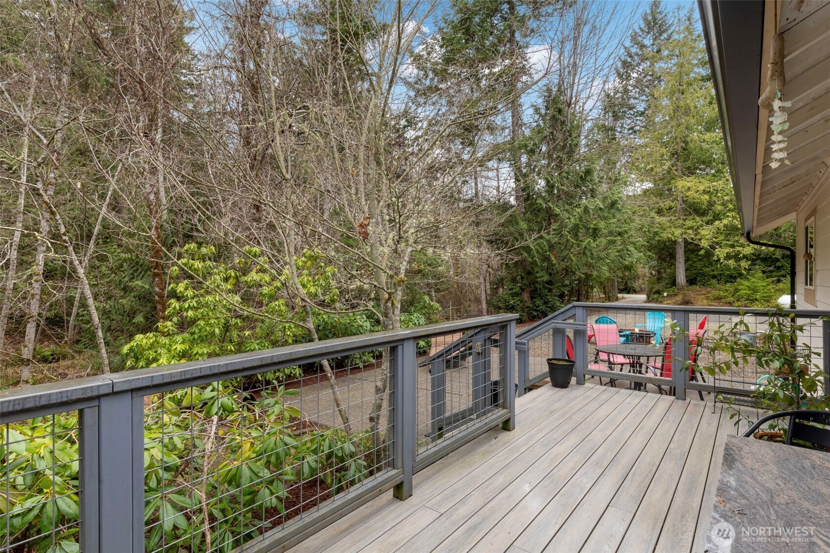 9240 Priddy Vista Road Northwest Seabeck, WA 98380 - Photo 25 of 40 a view of balcony with deck and outdoor seating