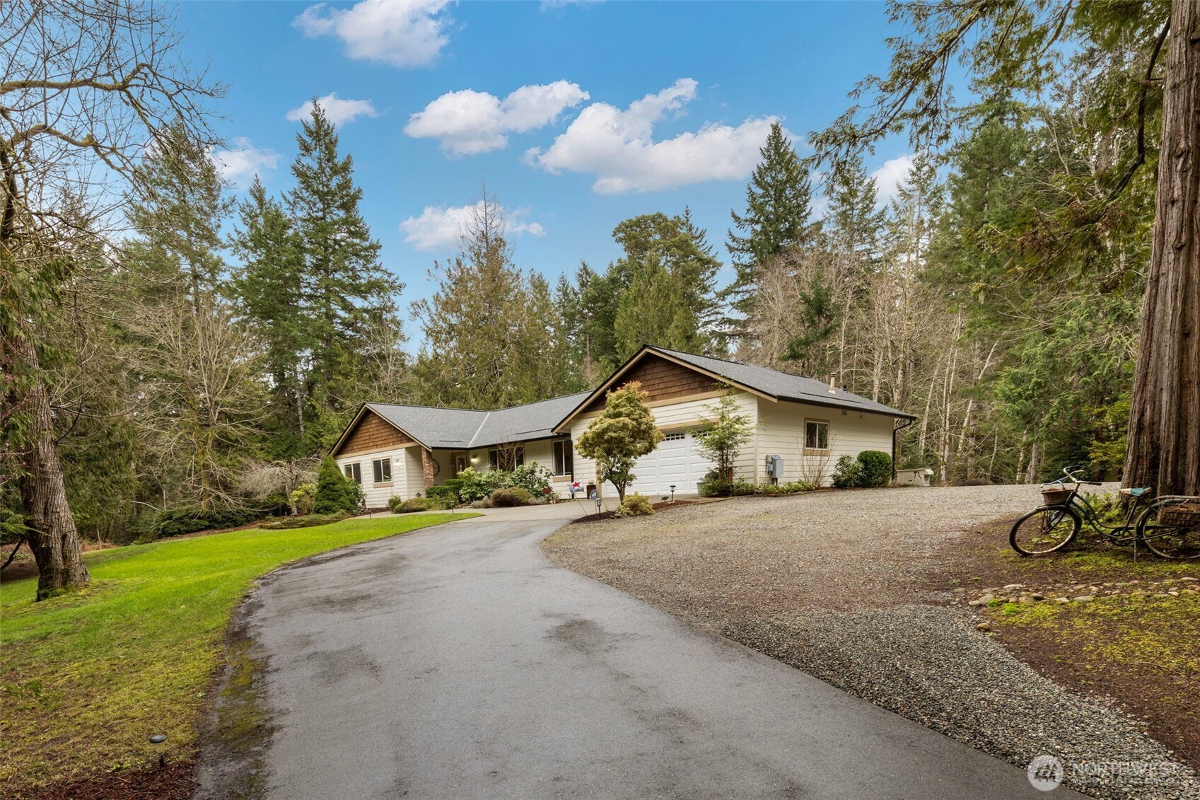 9240 Priddy Vista Road Northwest Seabeck, WA 98380 - Photo 35 of 40 a view of a house with backyard and garden