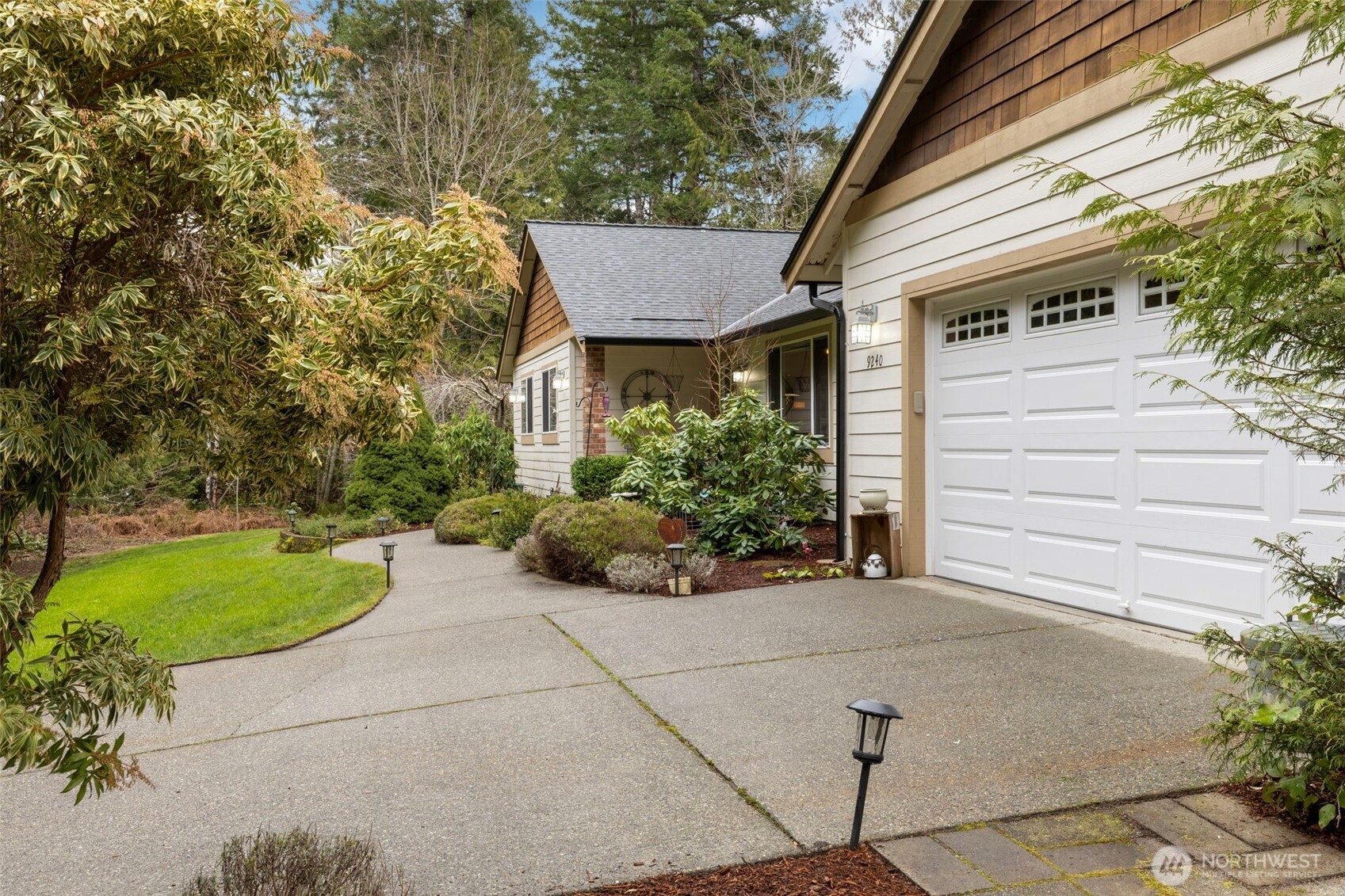 9240 Priddy Vista Road Northwest Seabeck, WA 98380 - Photo 36 of 40 a view of a house with backyard and garden