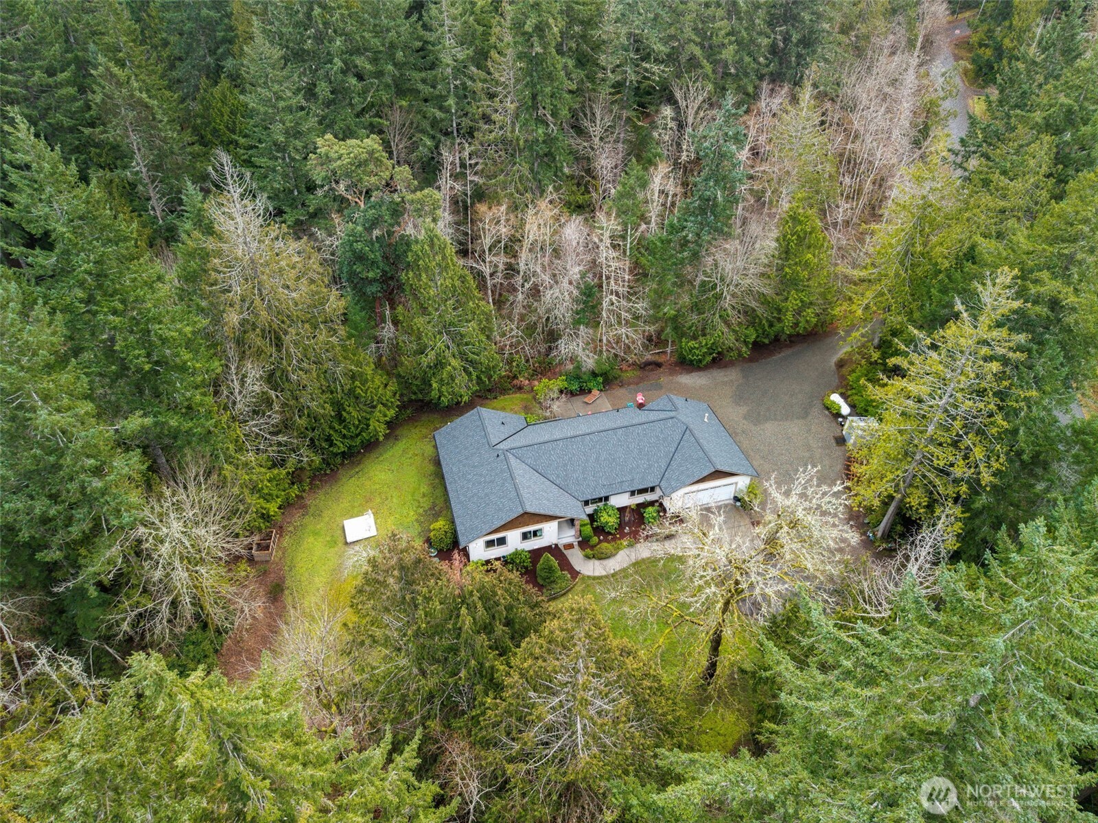 9240 Priddy Vista Road Northwest Seabeck, WA 98380 - Photo 37 of 40 an aerial view of a house with yard swimming pool and outdoor seating