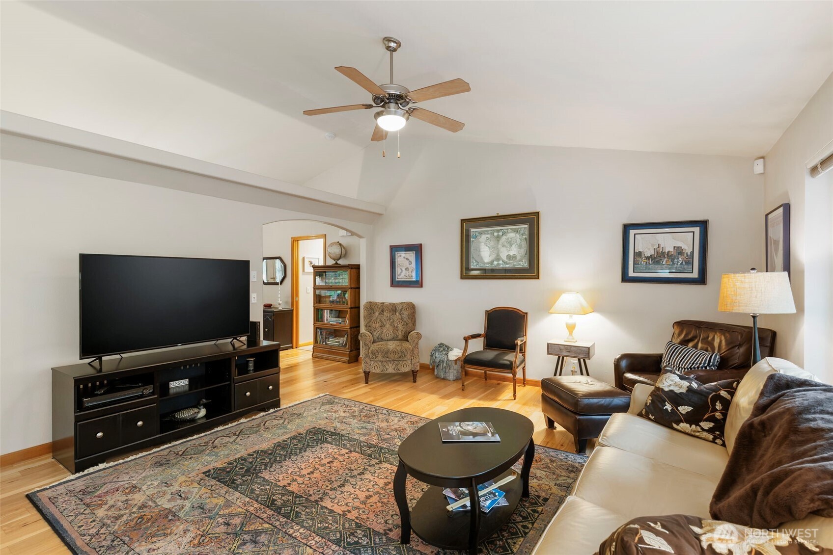 9240 Priddy Vista Road Northwest Seabeck, WA 98380 - Photo 7 of 40 a living room with furniture and a flat screen tv