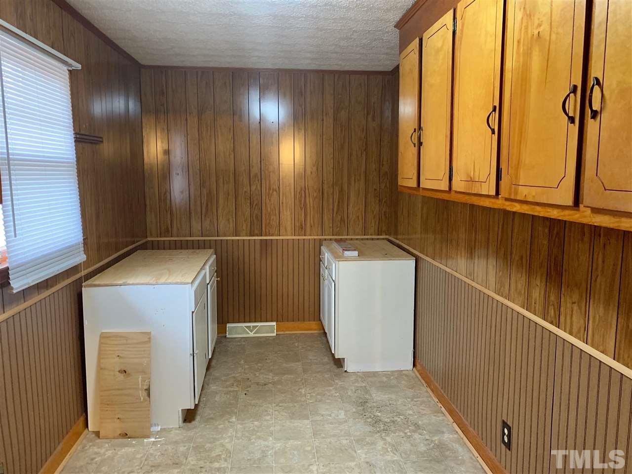 300 Thomas Humphries Road Roxboro, NC 27574 - Photo 11 of 22 Laundry room is large enough for washer, dryer, freezer and other storage.