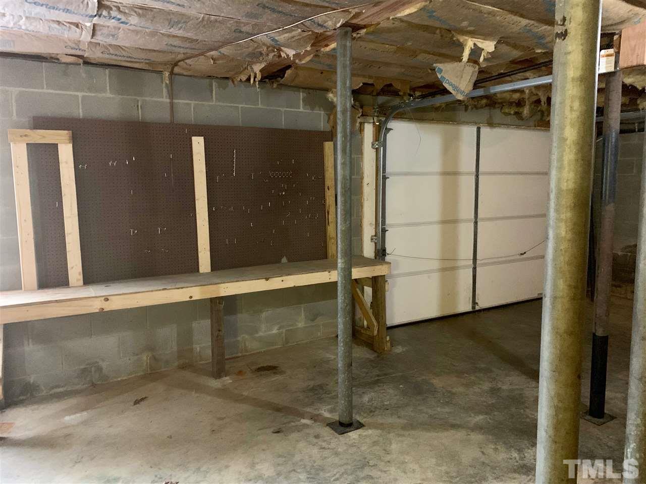 300 Thomas Humphries Road Roxboro, NC 27574 - Photo 19 of 22 There is a garage door and exterior access to basement, as well as interior access.