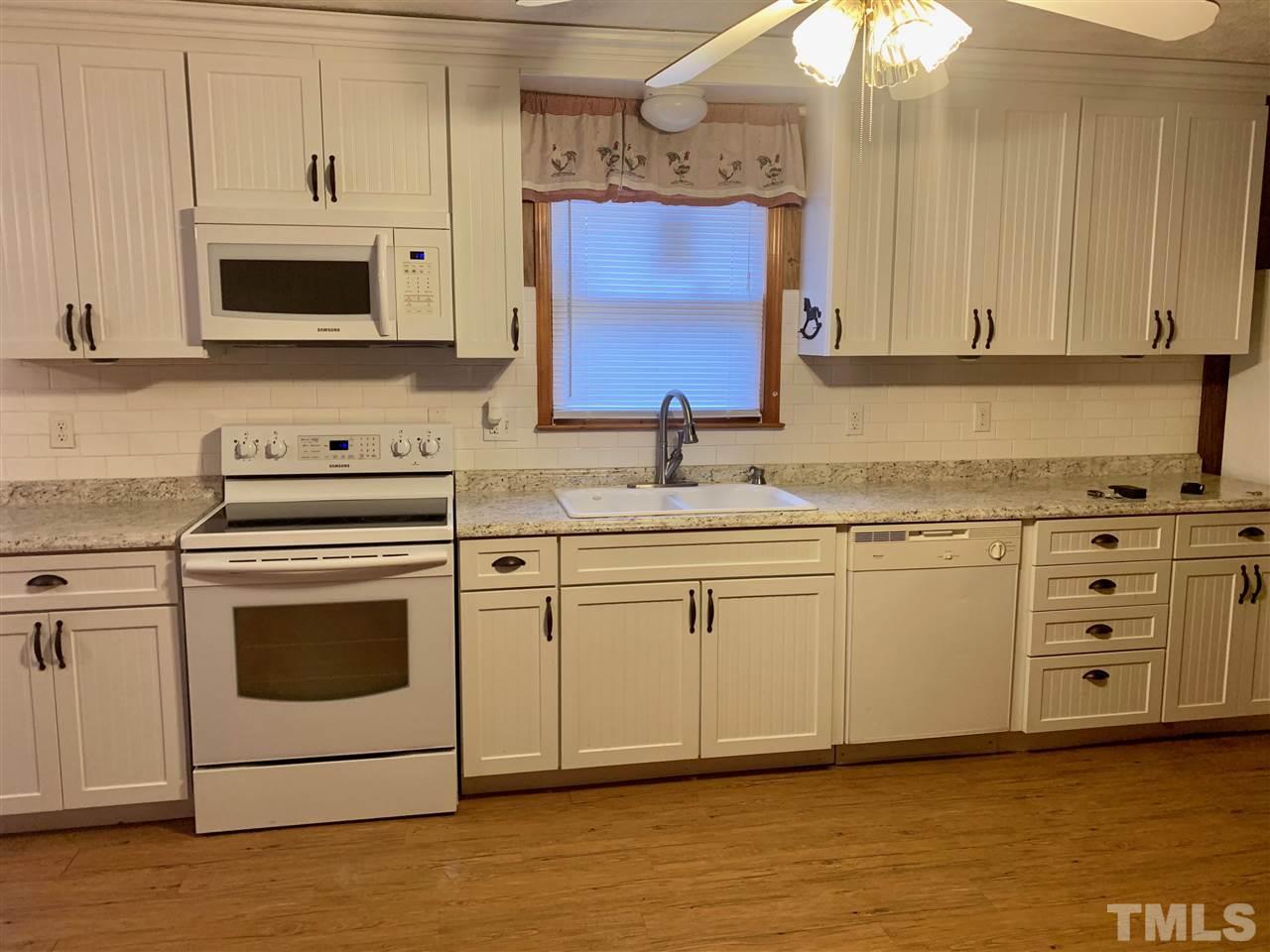 300 Thomas Humphries Road Roxboro, NC 27574 - Photo 5 of 22 Kitchen cabinets less than 2 years old. Dishwasher and refrigerator.