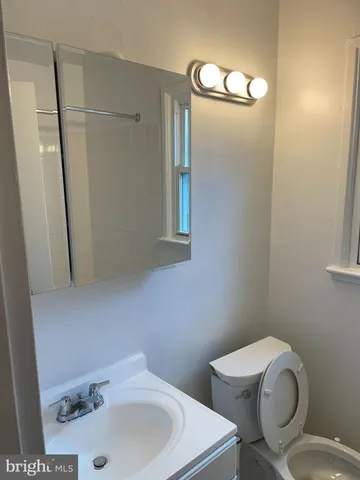 a bathroom with sink and mirror