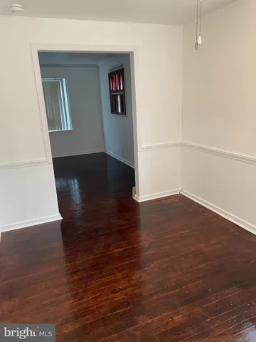 a view of a livingroom with wooden floor