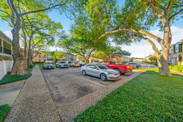 a view of yard with cars parked