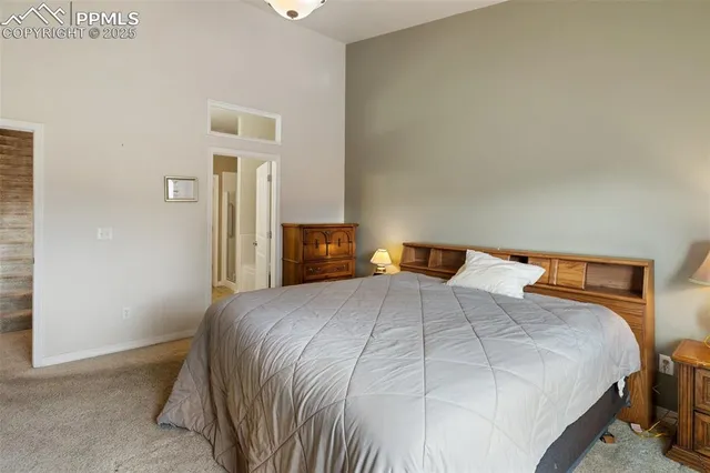 a bedroom with a bed and a closet