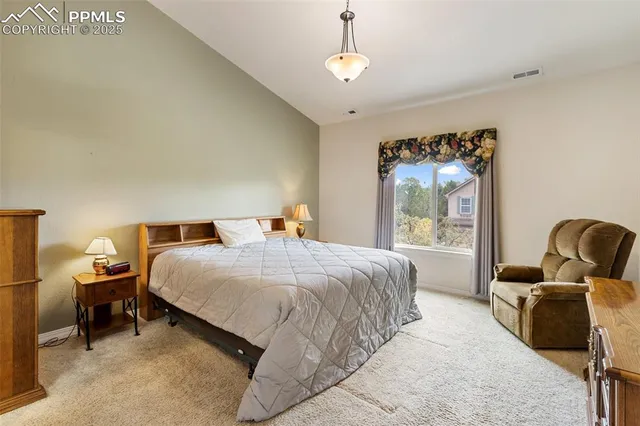 a bedroom with bed and window