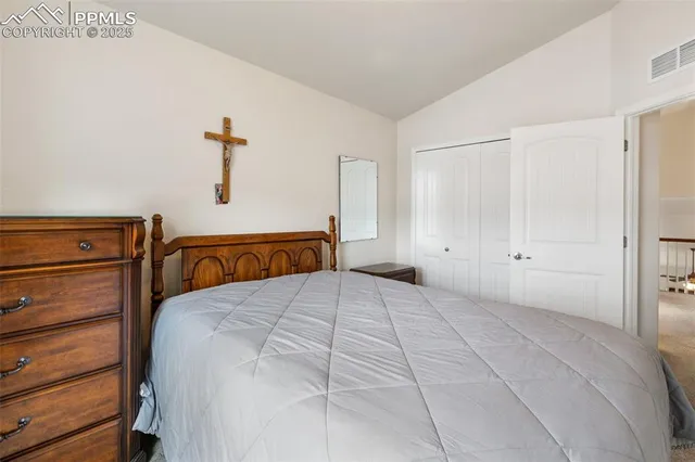a bedroom with a bed and a cabinets