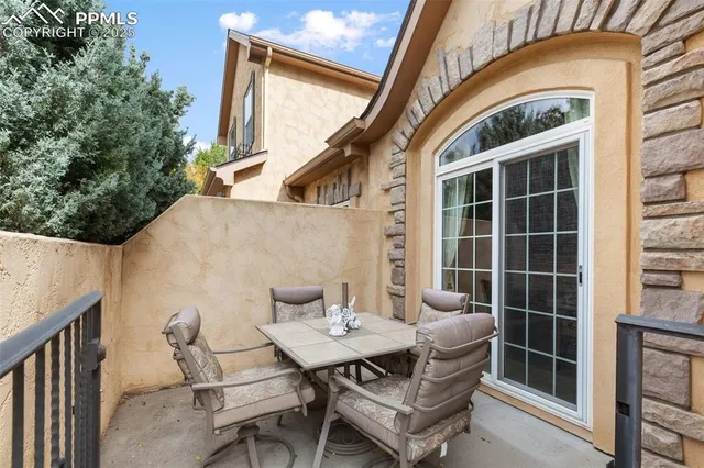 a view of a patio in the backyard