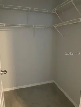 a view of an empty walk in closet