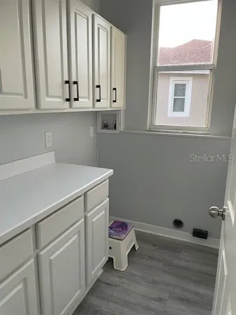 a view of cabinets and wooden floor