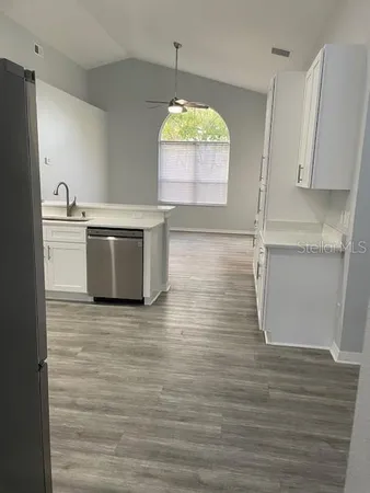 a room with wooden floor and window