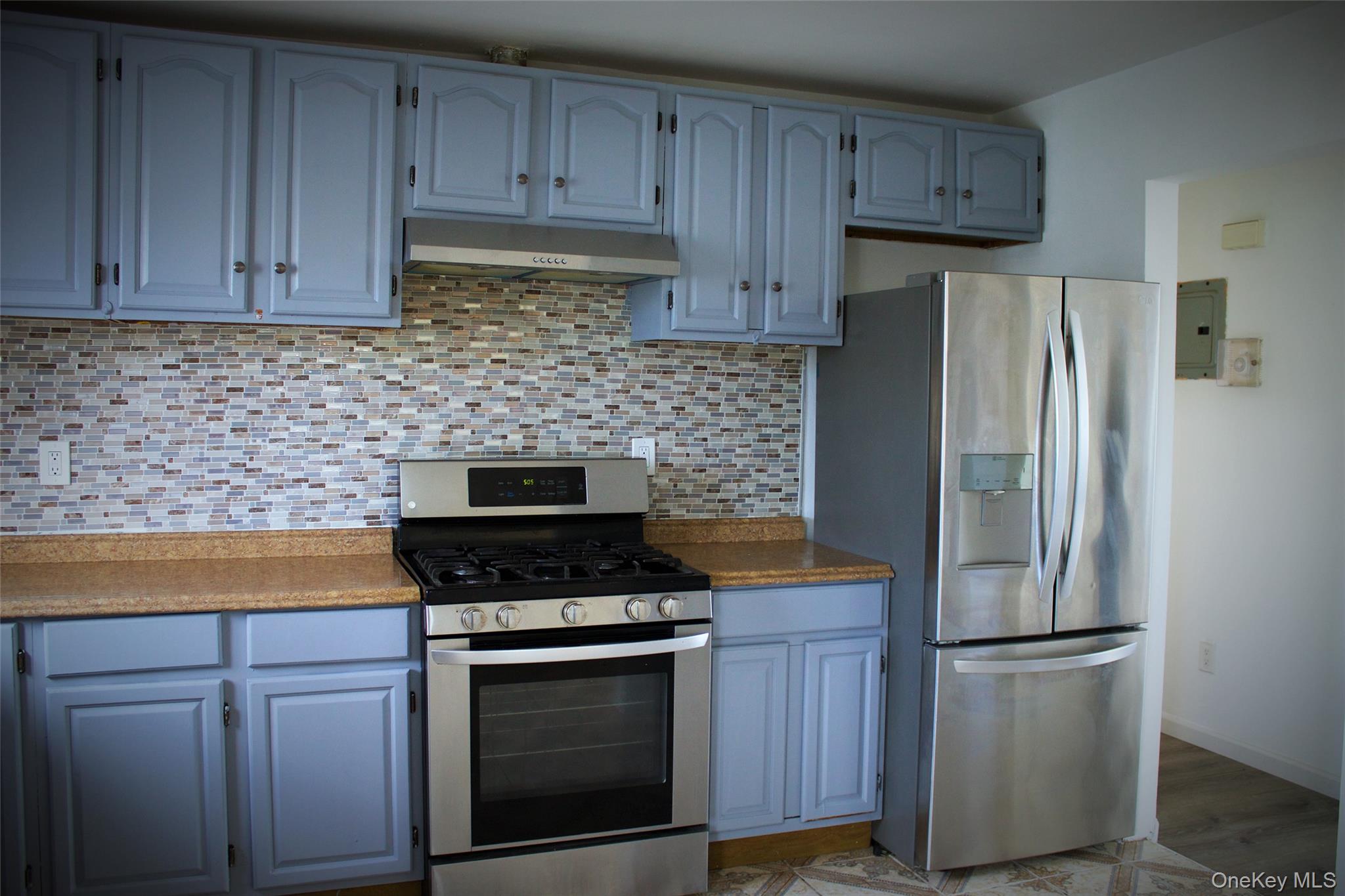 174-27 126th Avenue, Unit 2 Queens, NY 11434 - Photo 6 of 12 a kitchen with appliances cabinets and a counter space