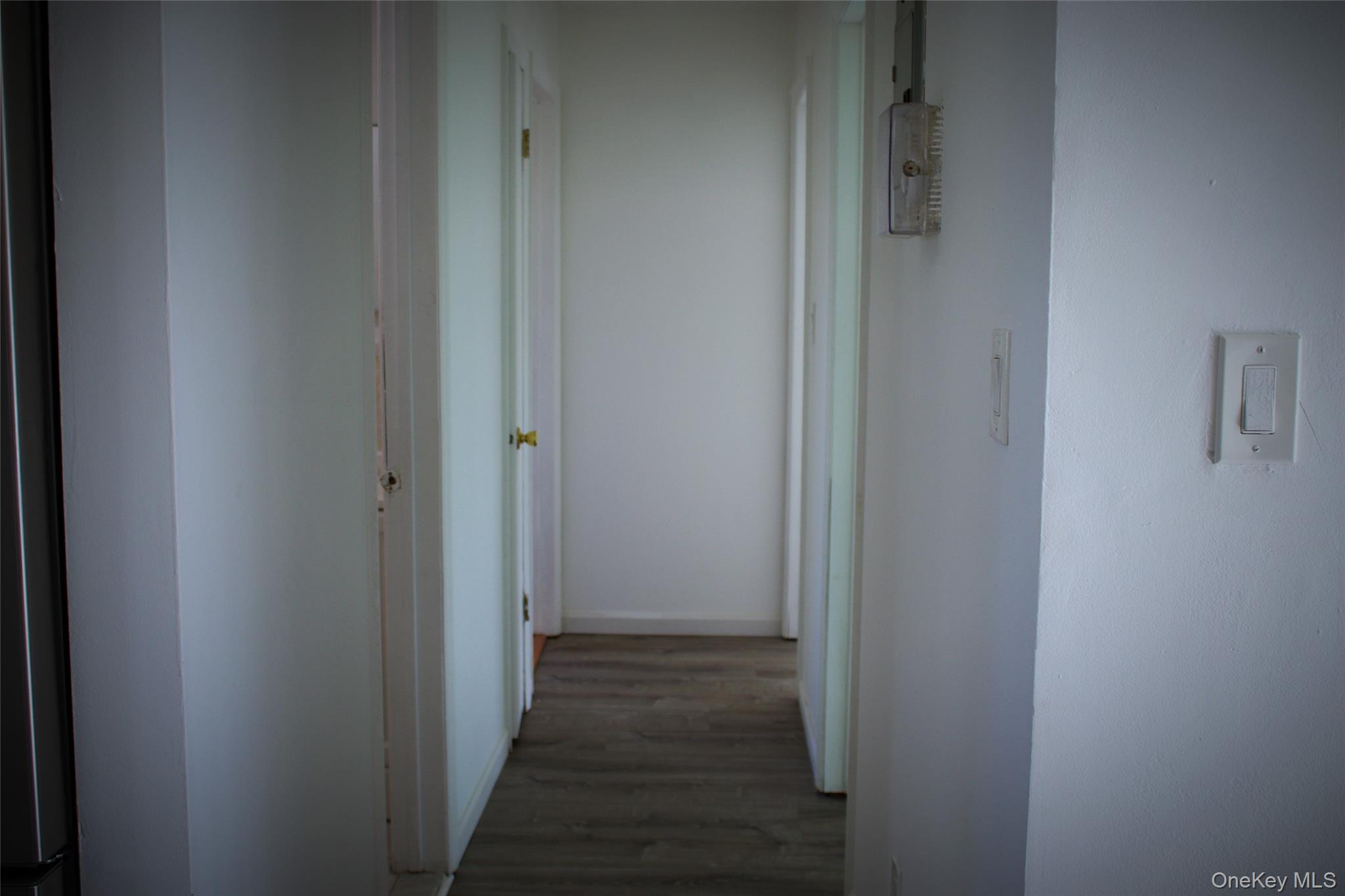 174-27 126th Avenue, Unit 2 Queens, NY 11434 - Photo 7 of 12 a view of a hallway with a wooden floor